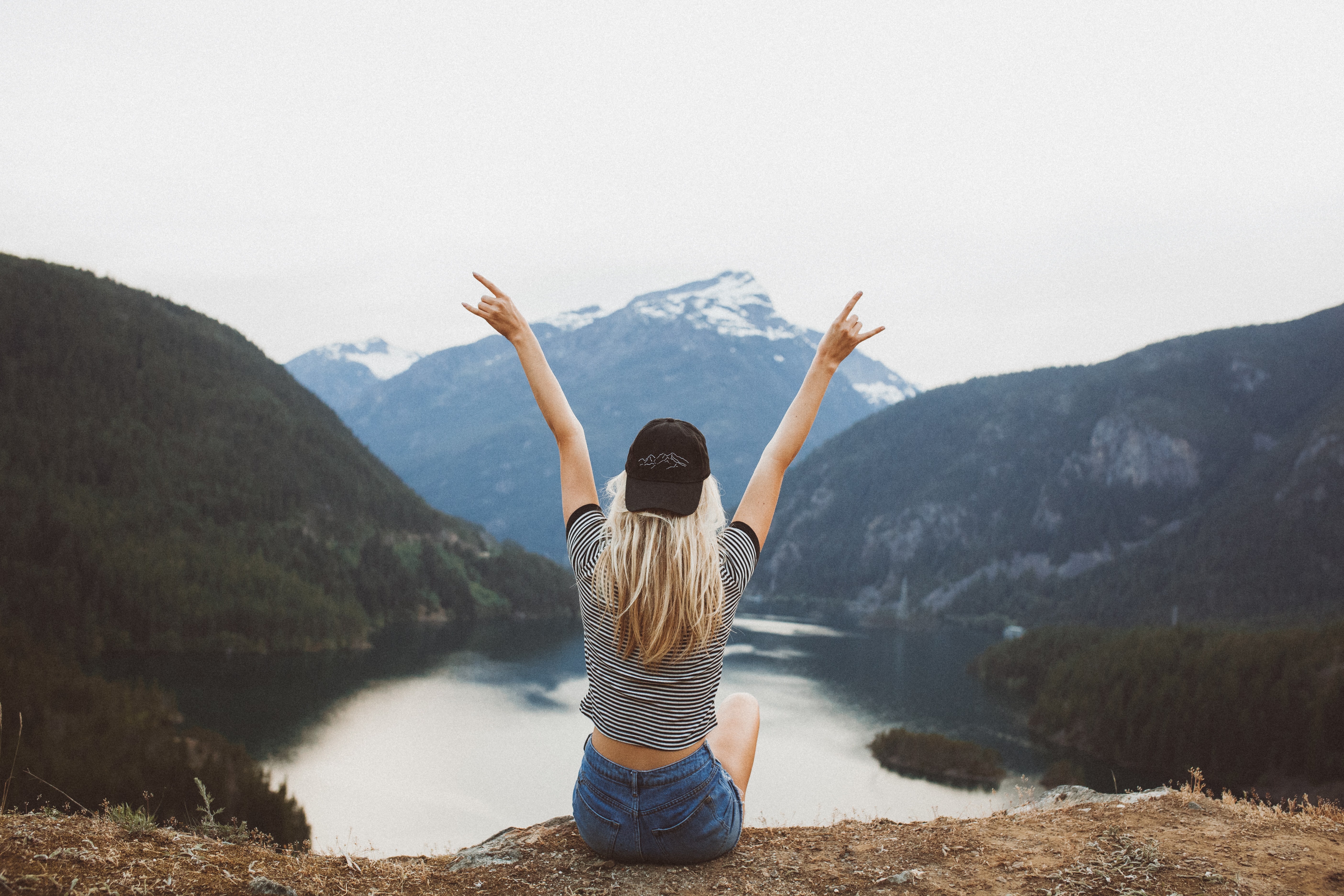 woman raising both hands